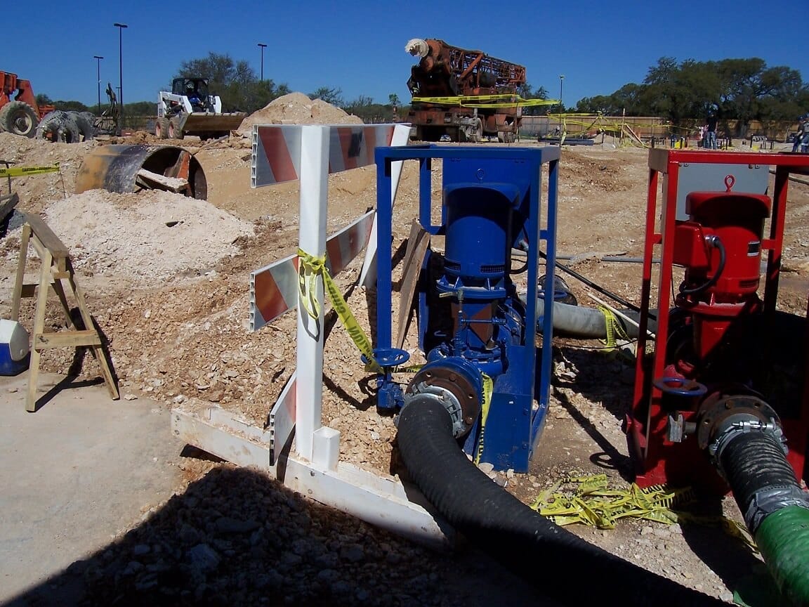 Pumps and hoses at a job site